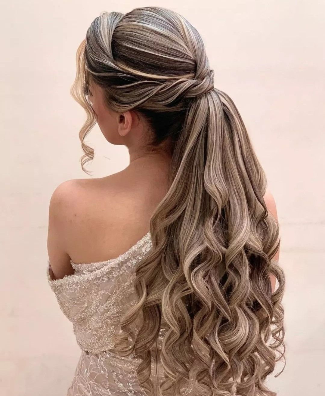 Half up ponytail with curls formal hairstyle