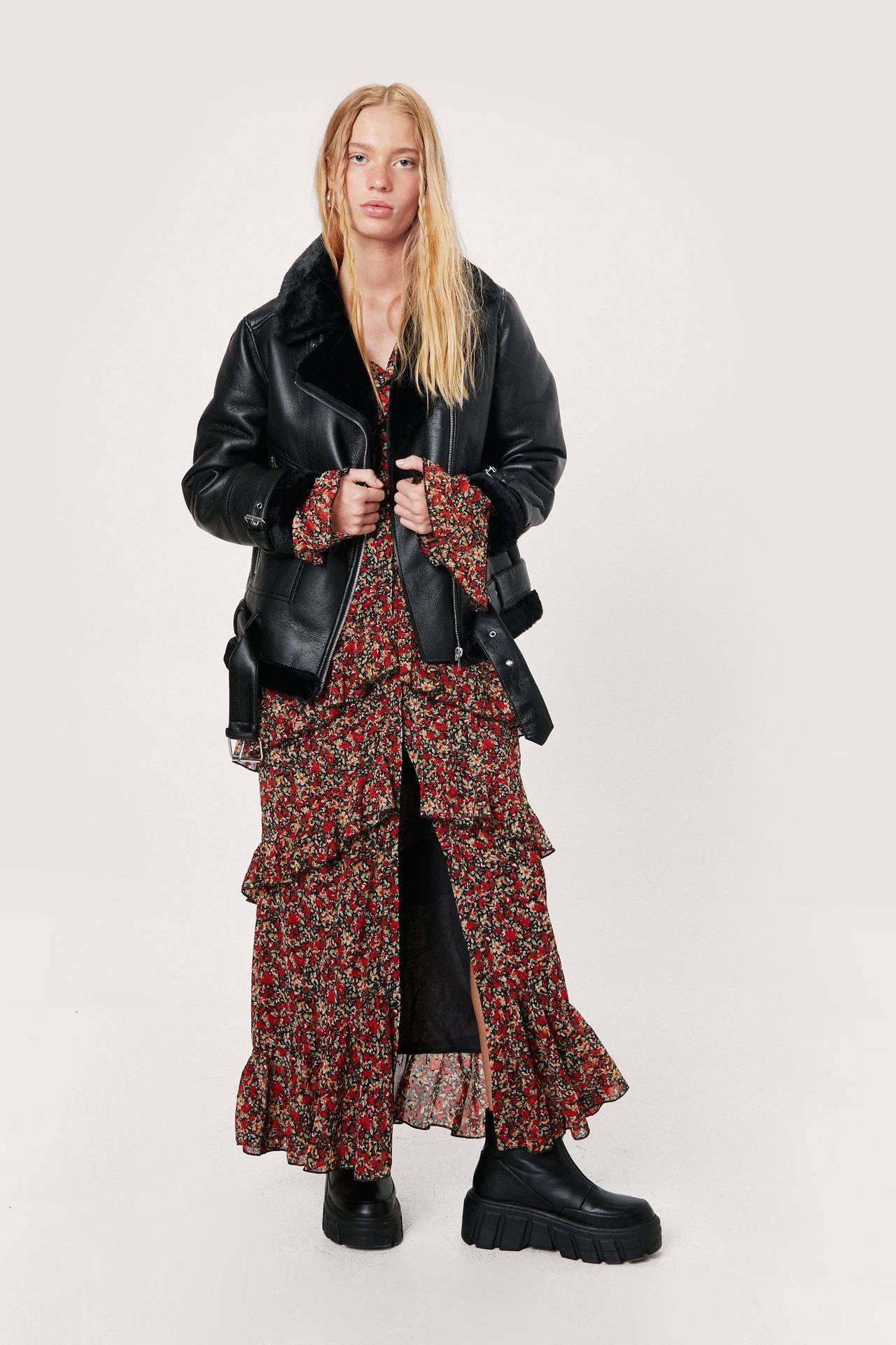 Woman in floral maxi dress with biker boots and leather jacket