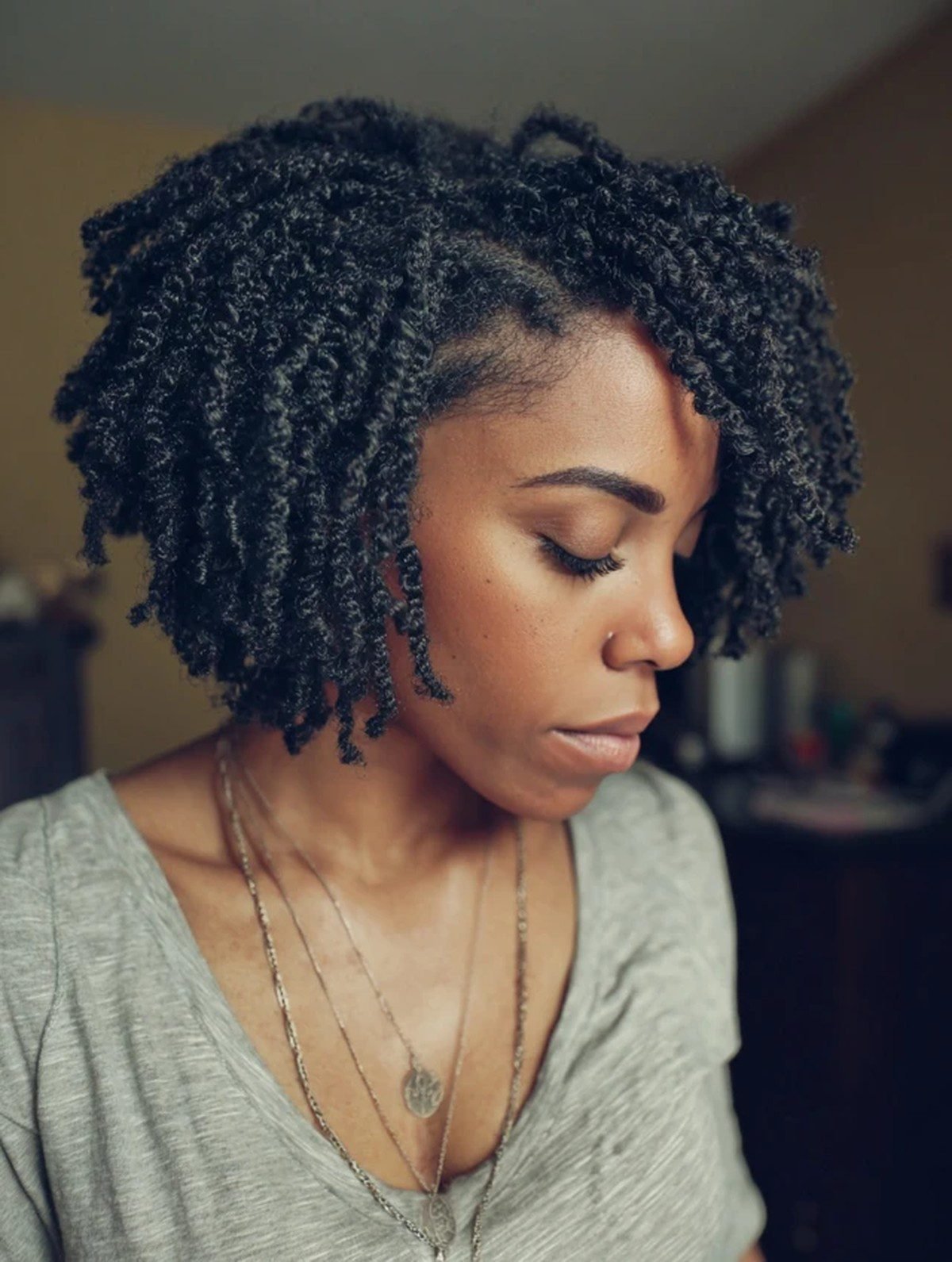 Black woman with a defined twist out on natural hair
