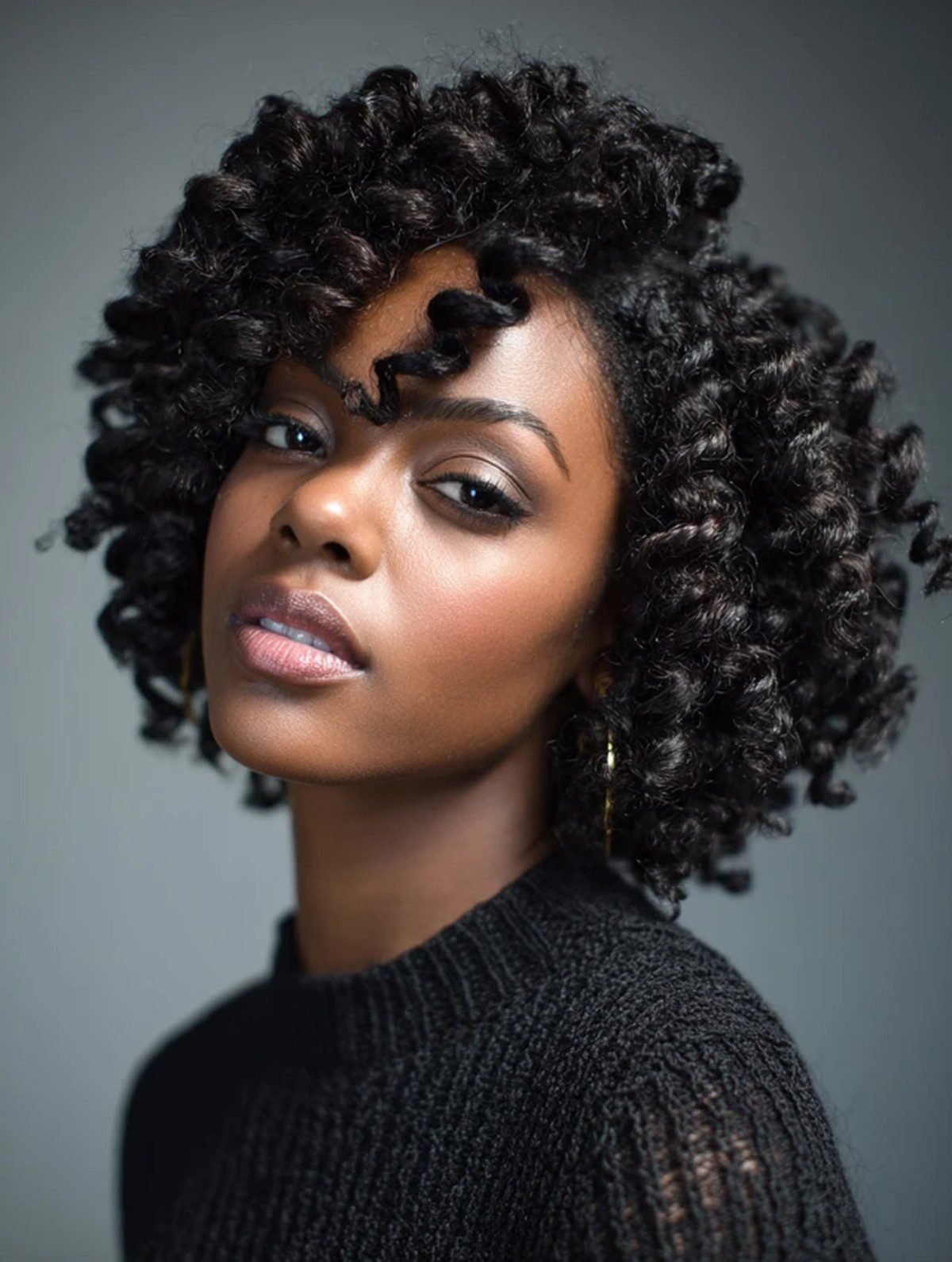 Black woman with crochet curls hairstyle