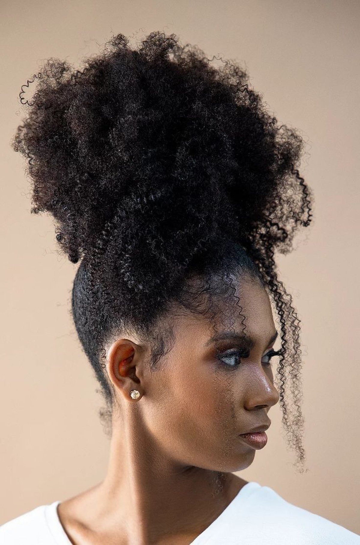 Black woman with a faux hawk updo on natural hair