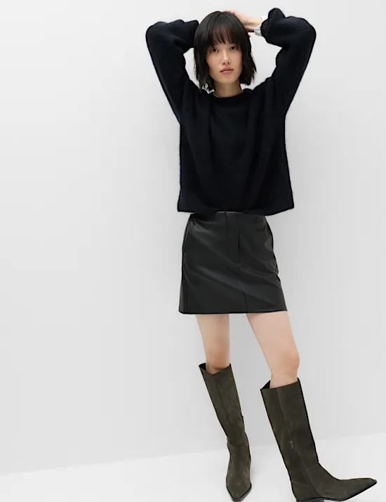 Oversized black sweater with faux leather skirt fall