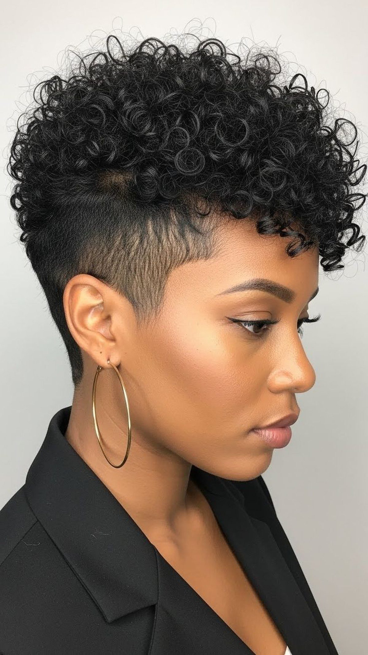 Black woman with a tapered pixie cut