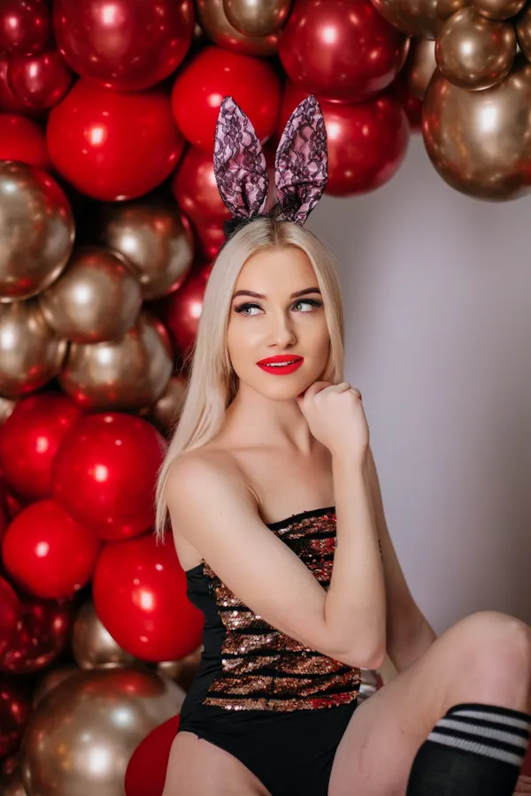Woman wearing a bunny baddie Halloween costume with ears