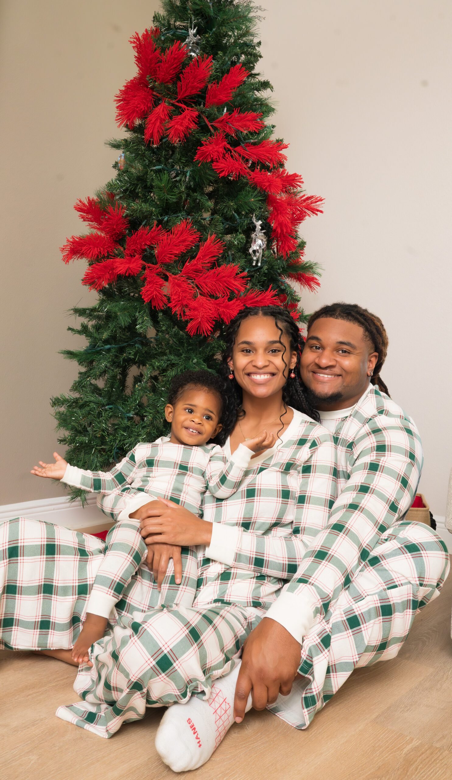 Couple in matching christmas pajamas photoshoot