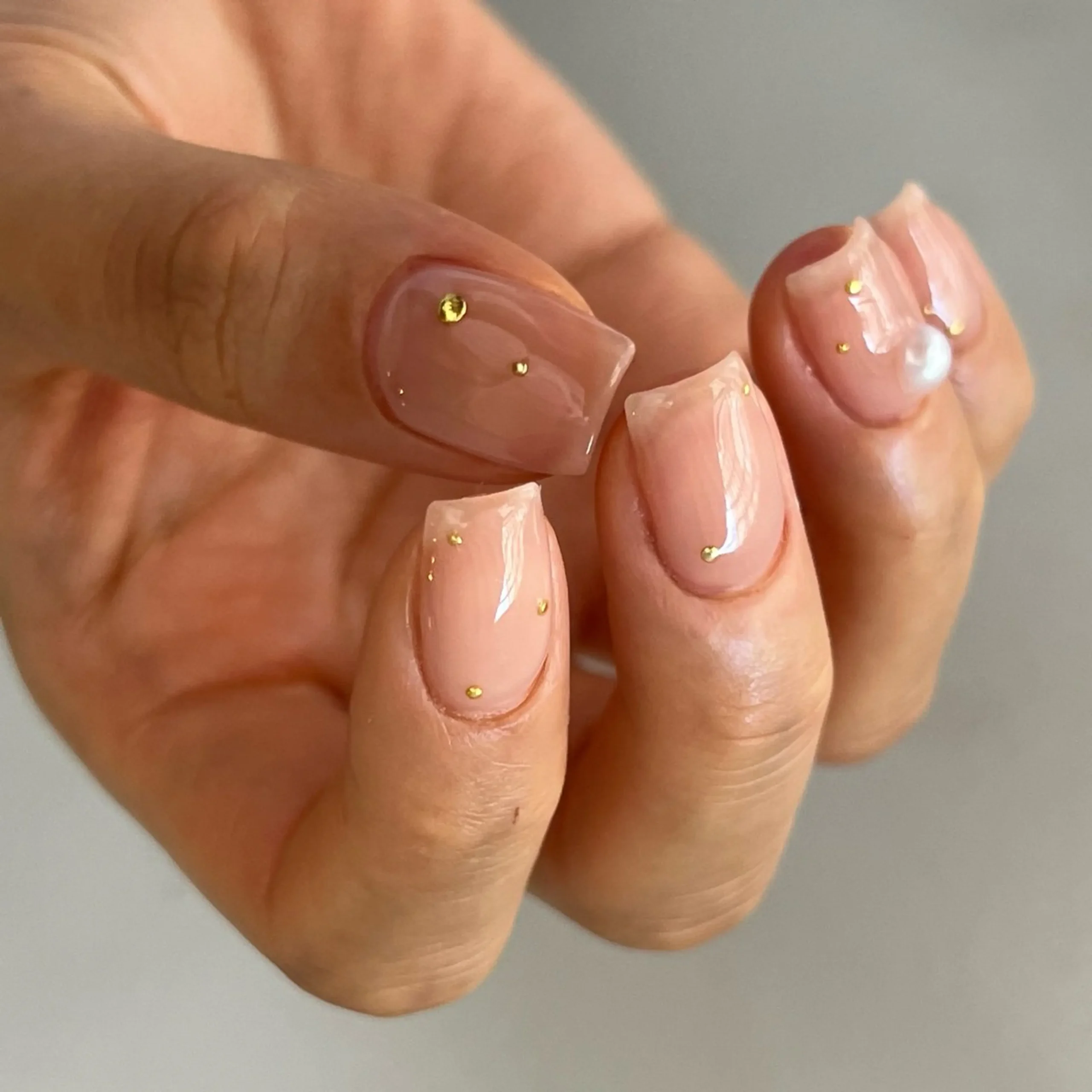 Sheer nude gold fleck nails