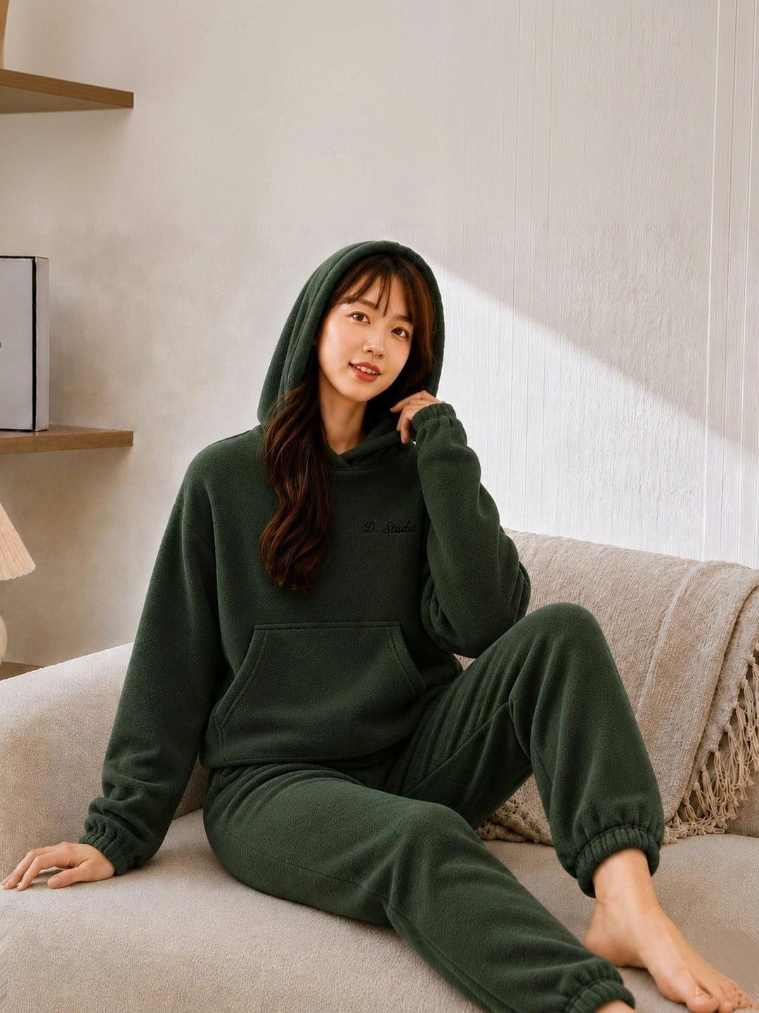 Woman in matching fleece lounge set at home