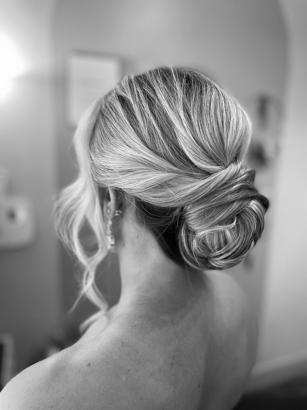 Low wrapped ponytail formal updo