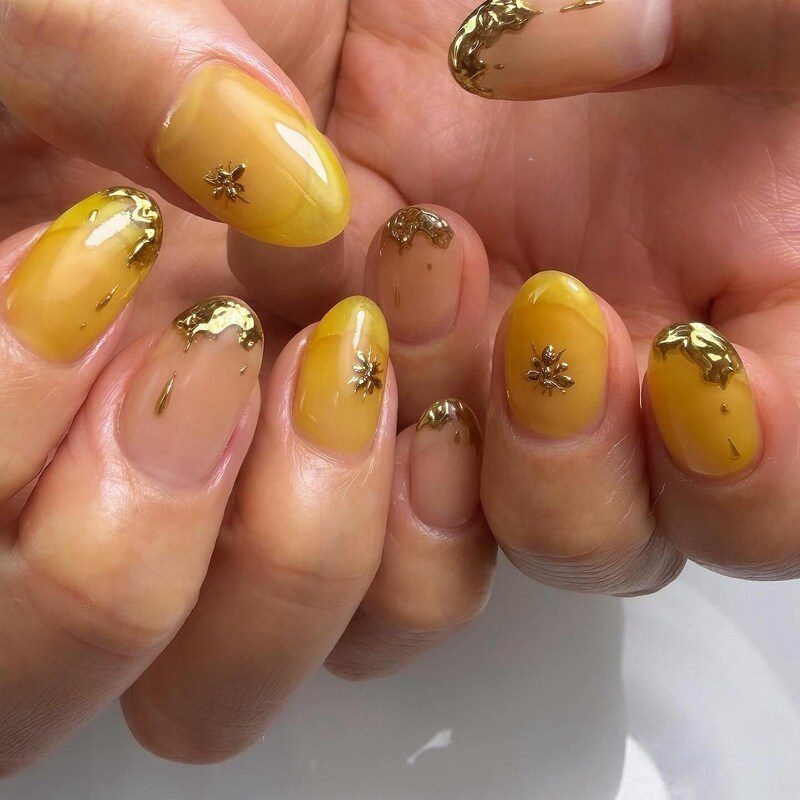 Honey nails with gold foil accents