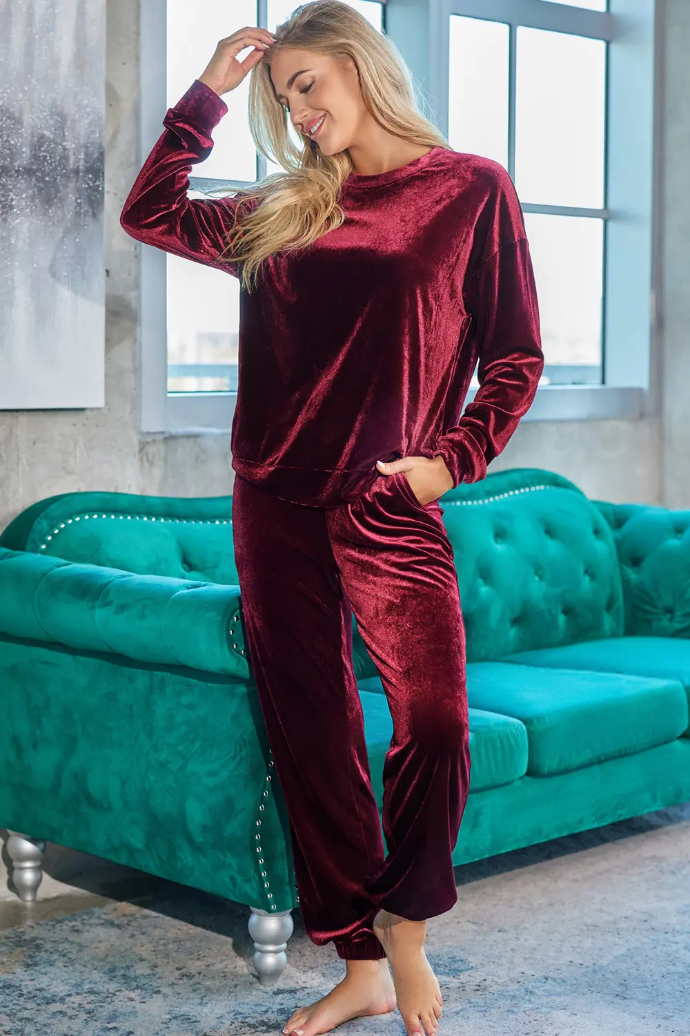 Woman in velvet lounge set at home