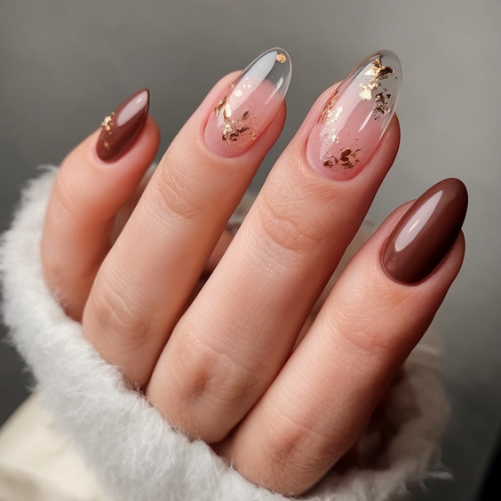 Soft taupe nails with delicate gold foil for mature women