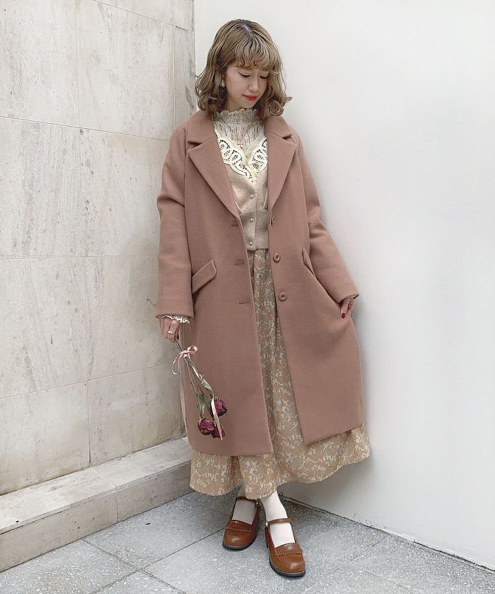Woman in prairie dress with long wool coat