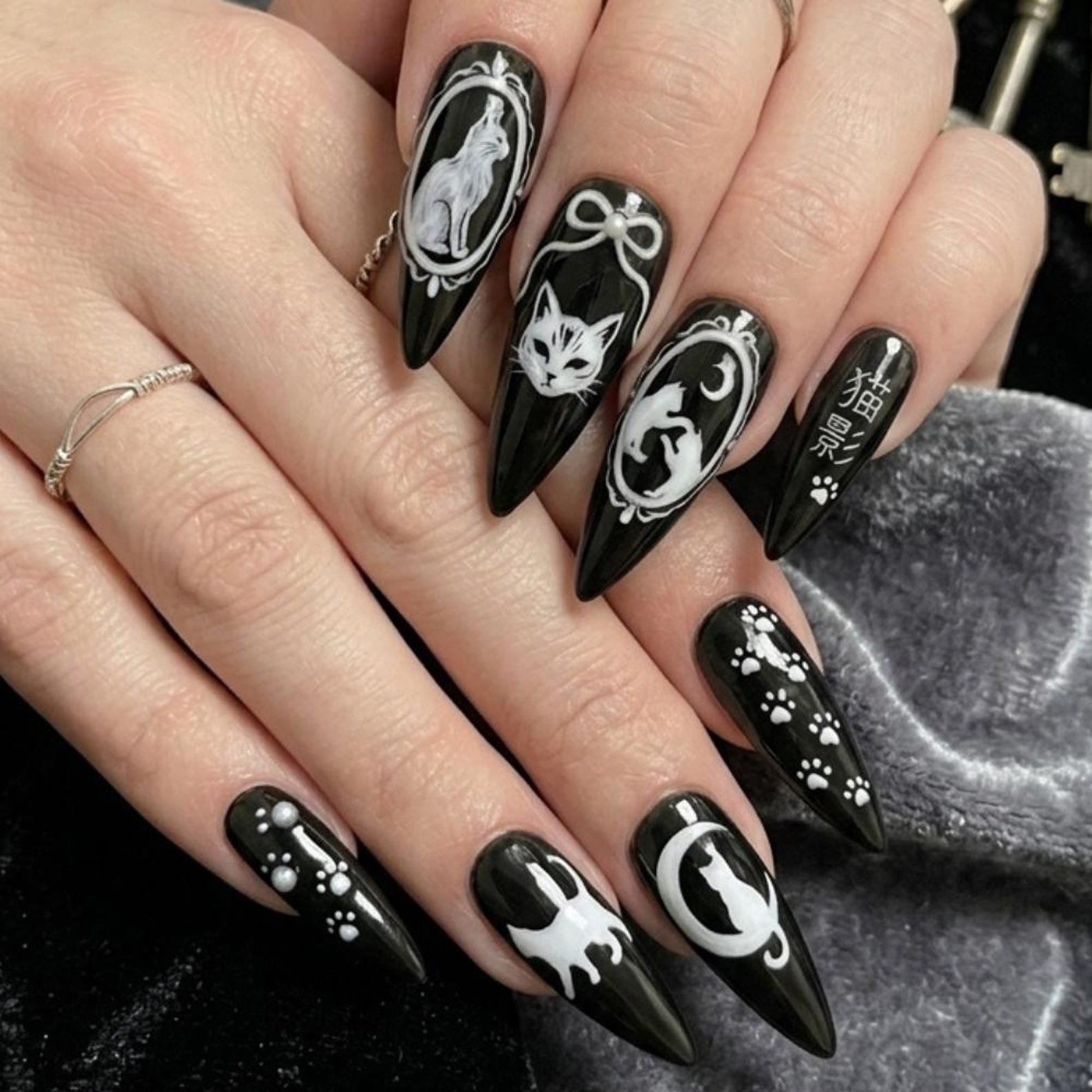 Black cat stiletto nail art design