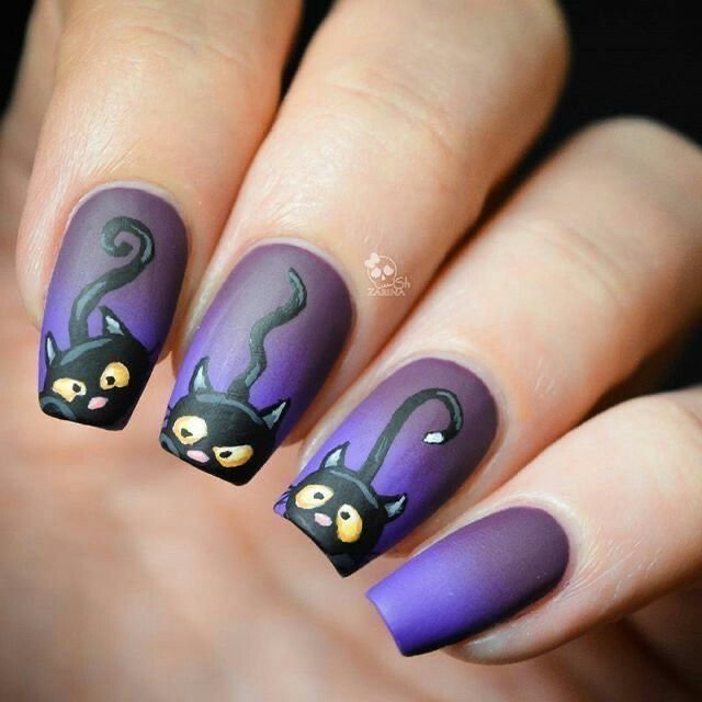 Black cat sitting on crescent moon Halloween nail design