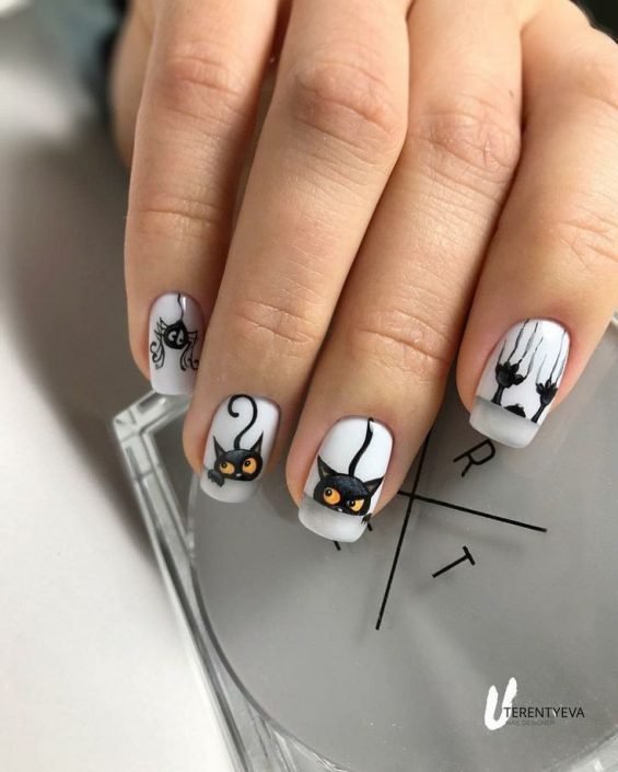 Minimalist single-line black cat face Halloween nails