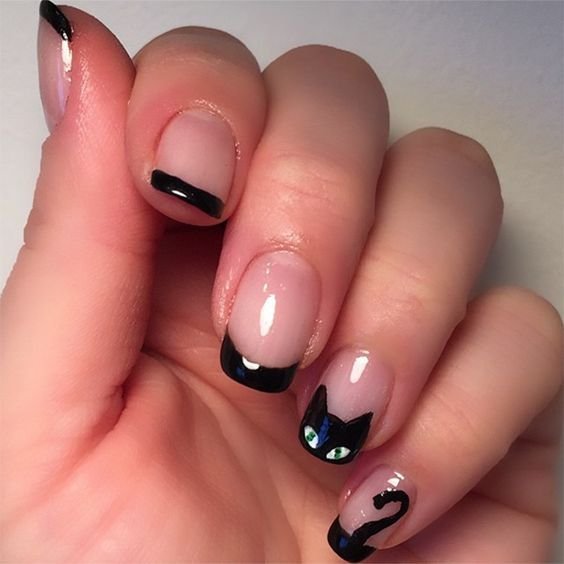 Black cat Halloween nails with spiderweb accents