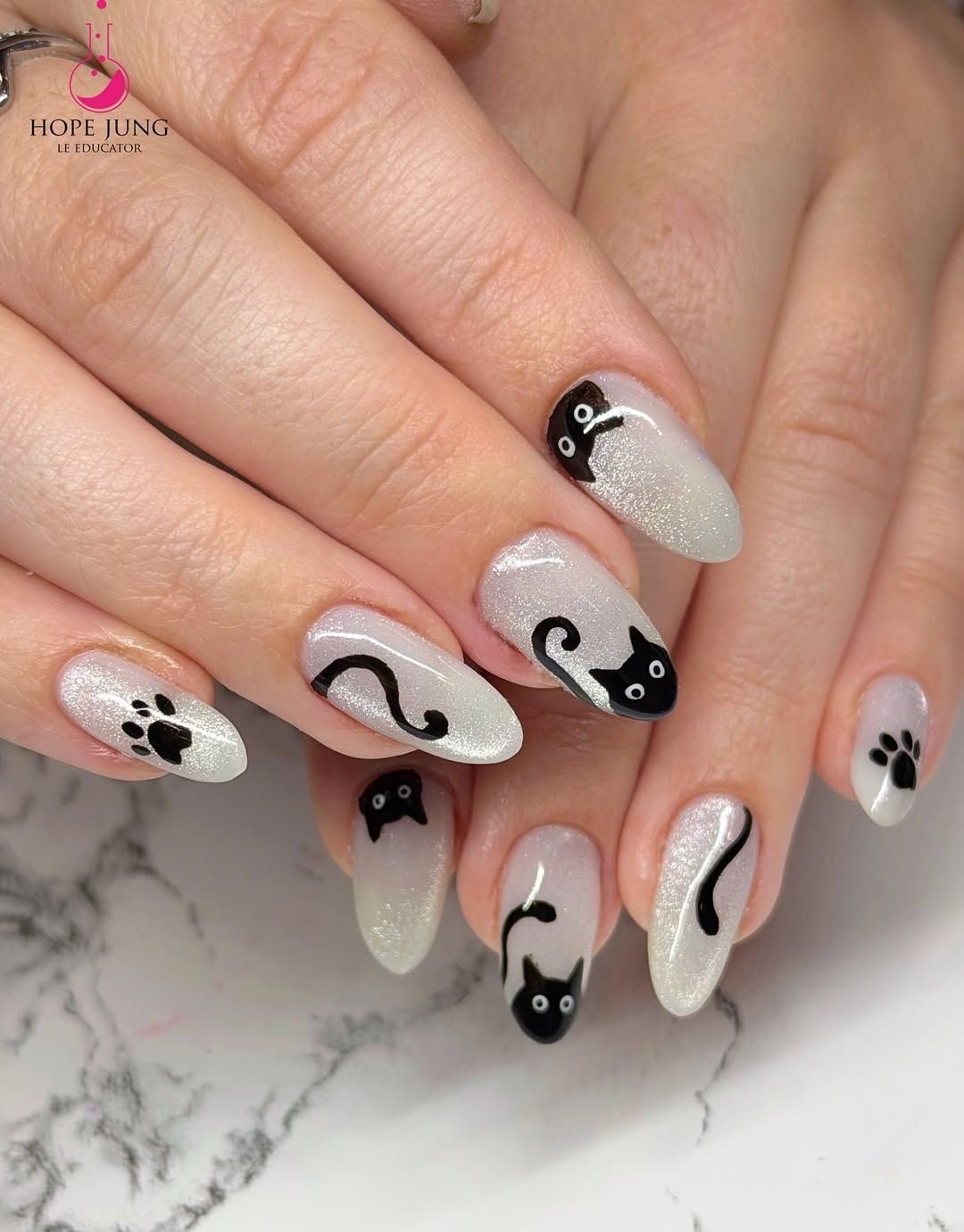 Black cat outline on clear jelly Halloween nails