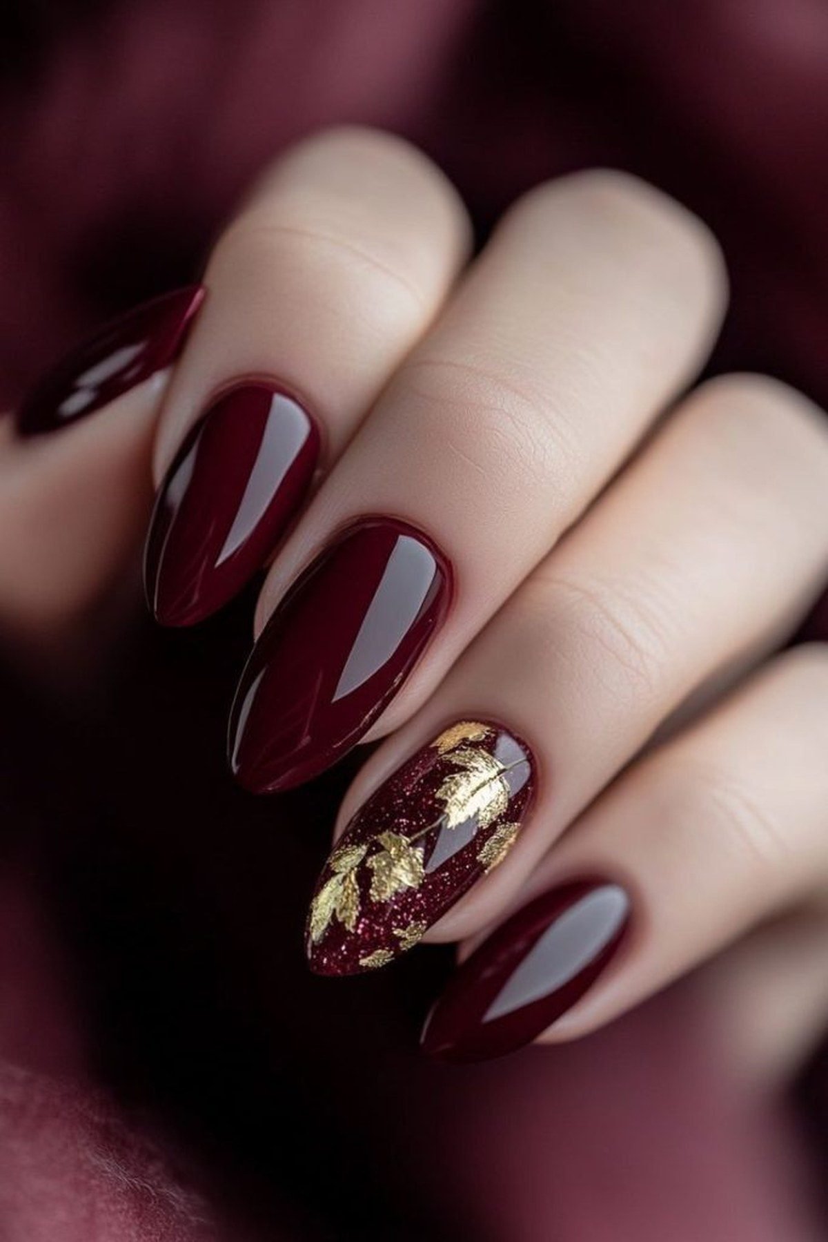 Burgundy nails with gold foil flakes for hoco