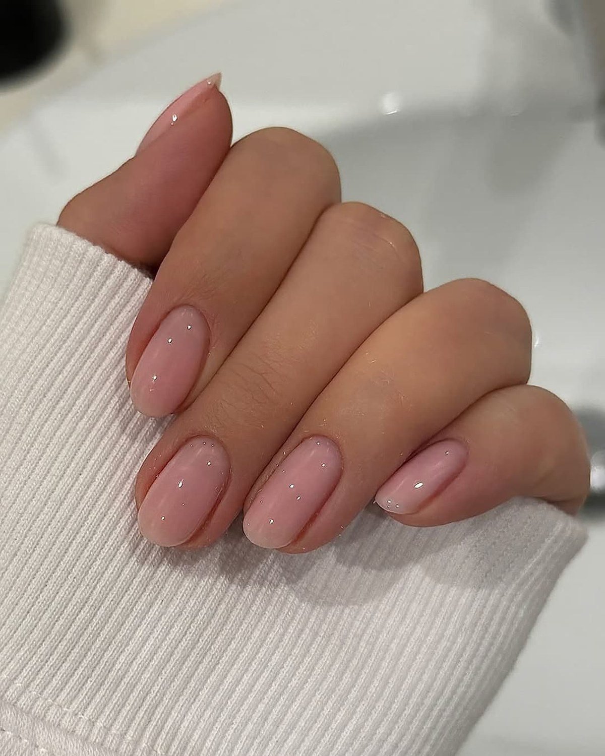 Blush pink hoco nails matching a pink corsage