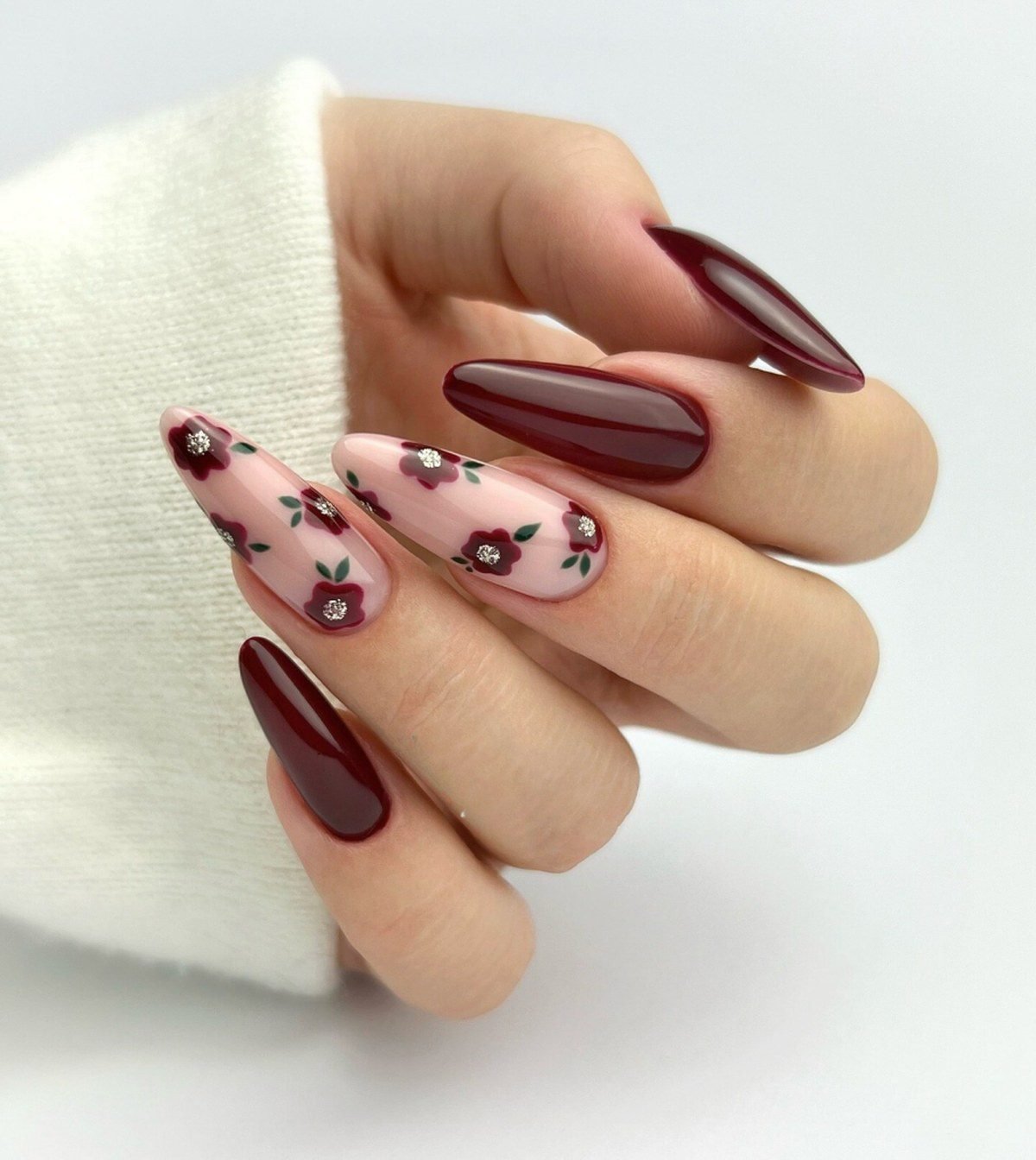 Burgundy ranunculus hoco nails matching a burgundy corsage