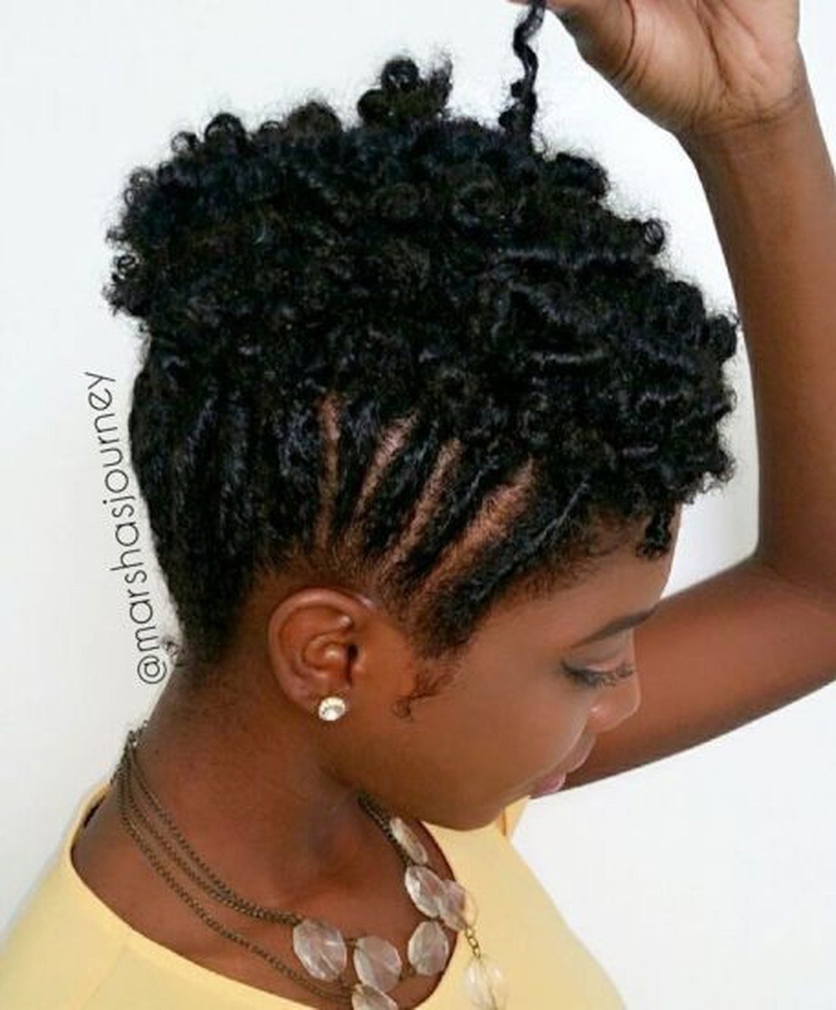 Finger coils pinned into an updo