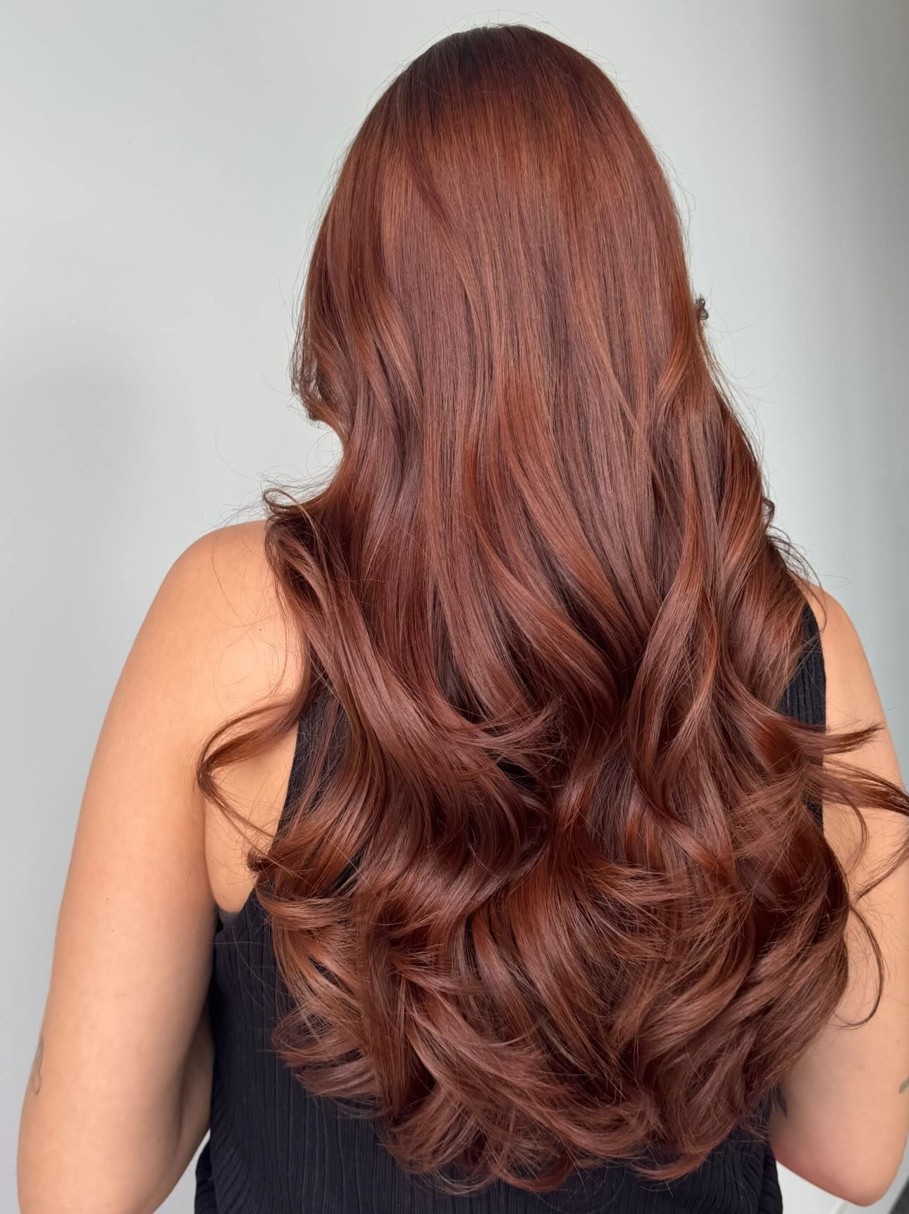 Subtle copper gloss on brunette hair
