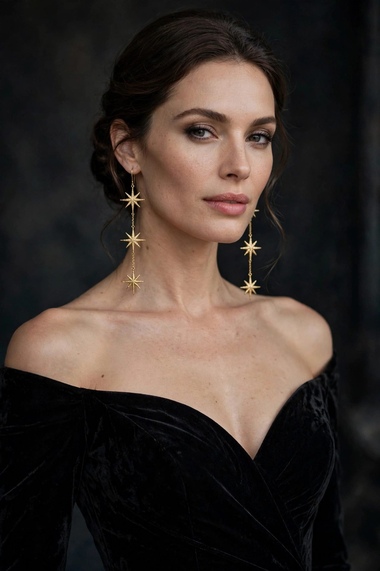 Woman wearing an evening gown with star drop earrings