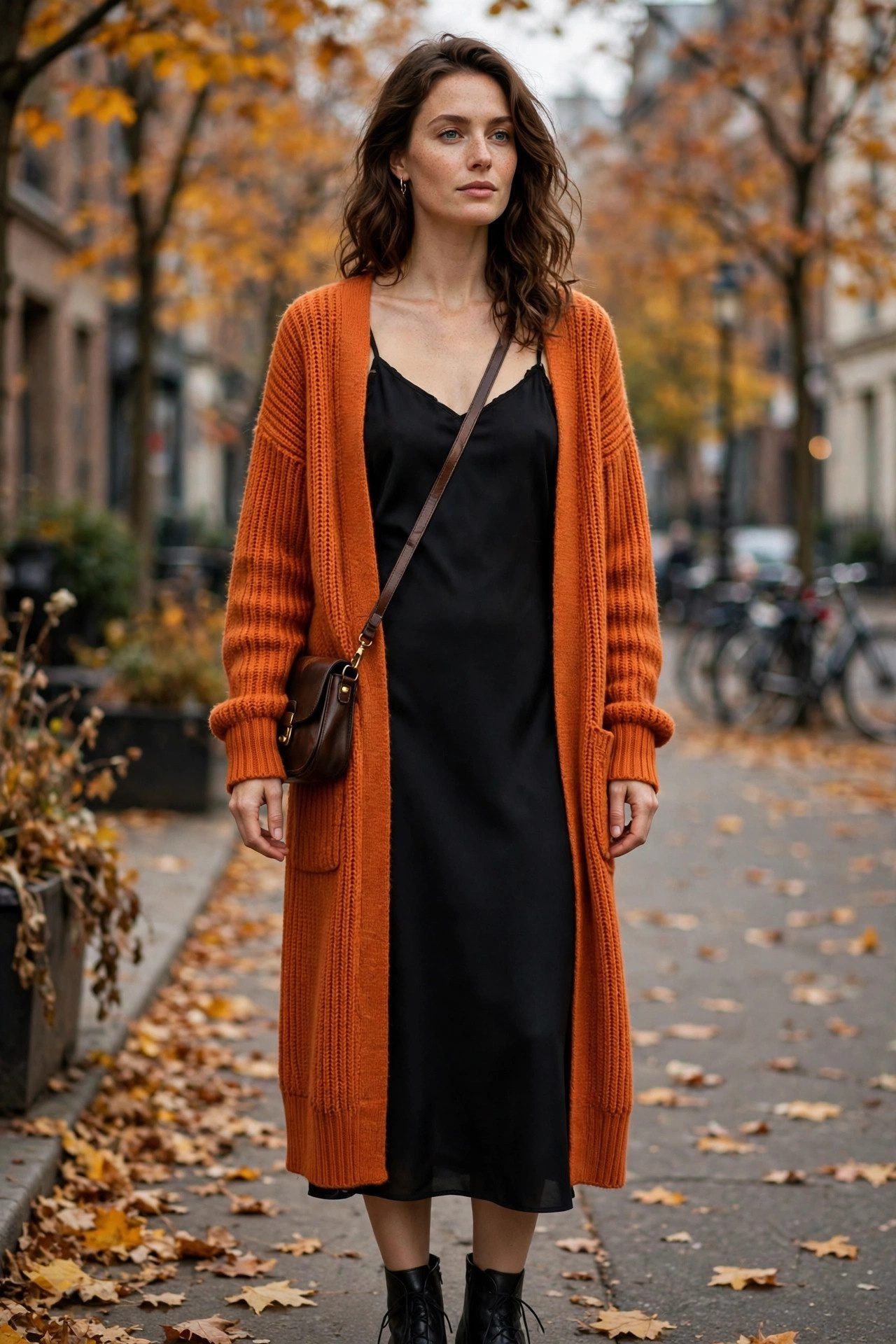 Black slip dress with orange cardigan October outfit