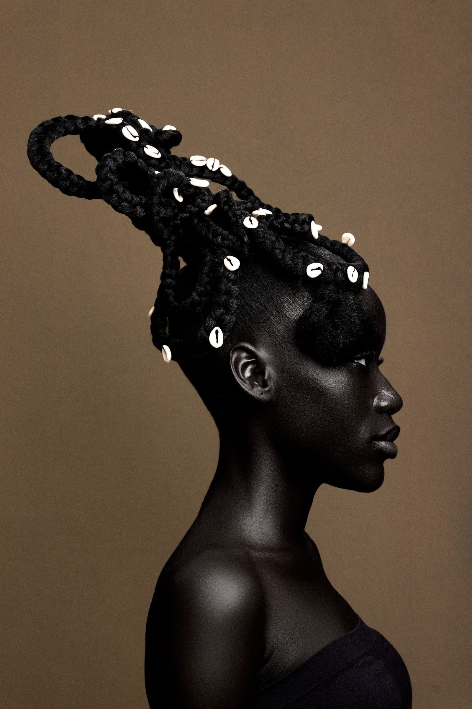 Cowrie shells decorating braids