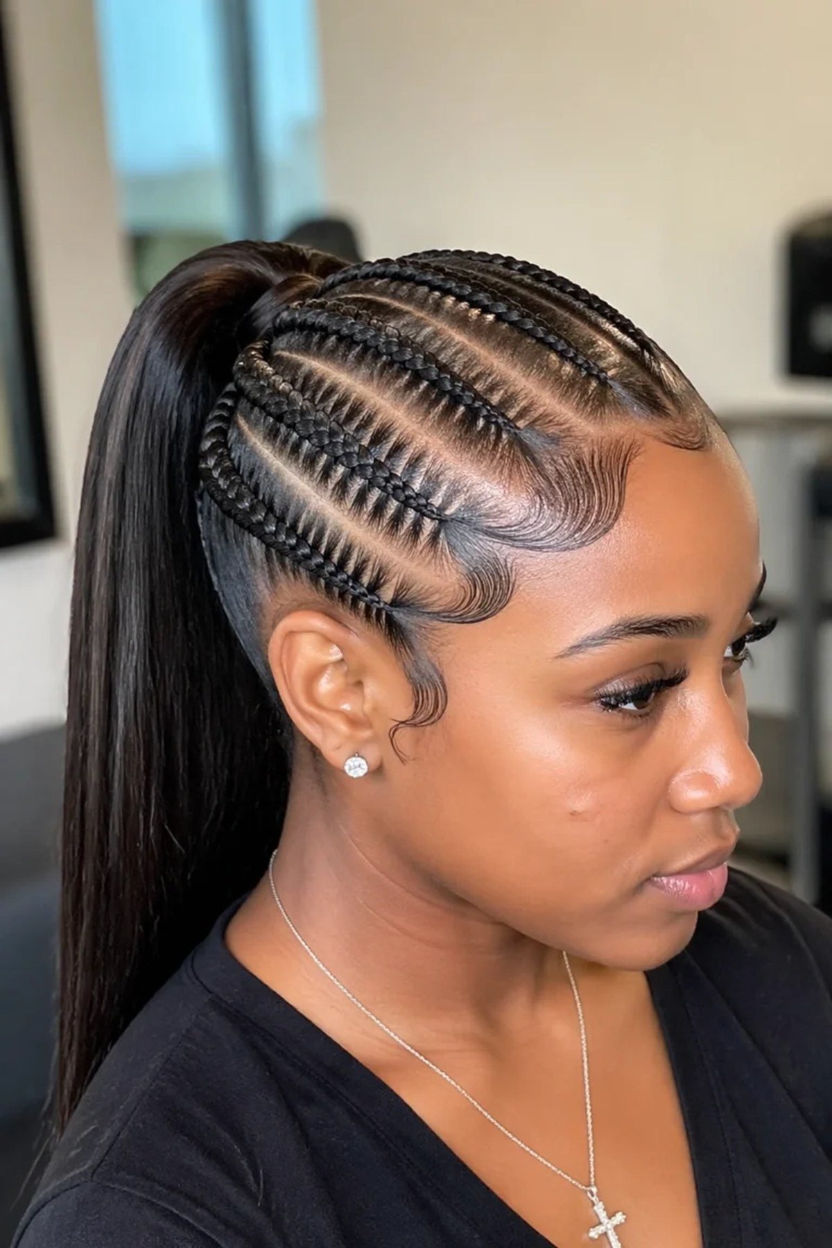 Feed-in braids pulled into a high ponytail