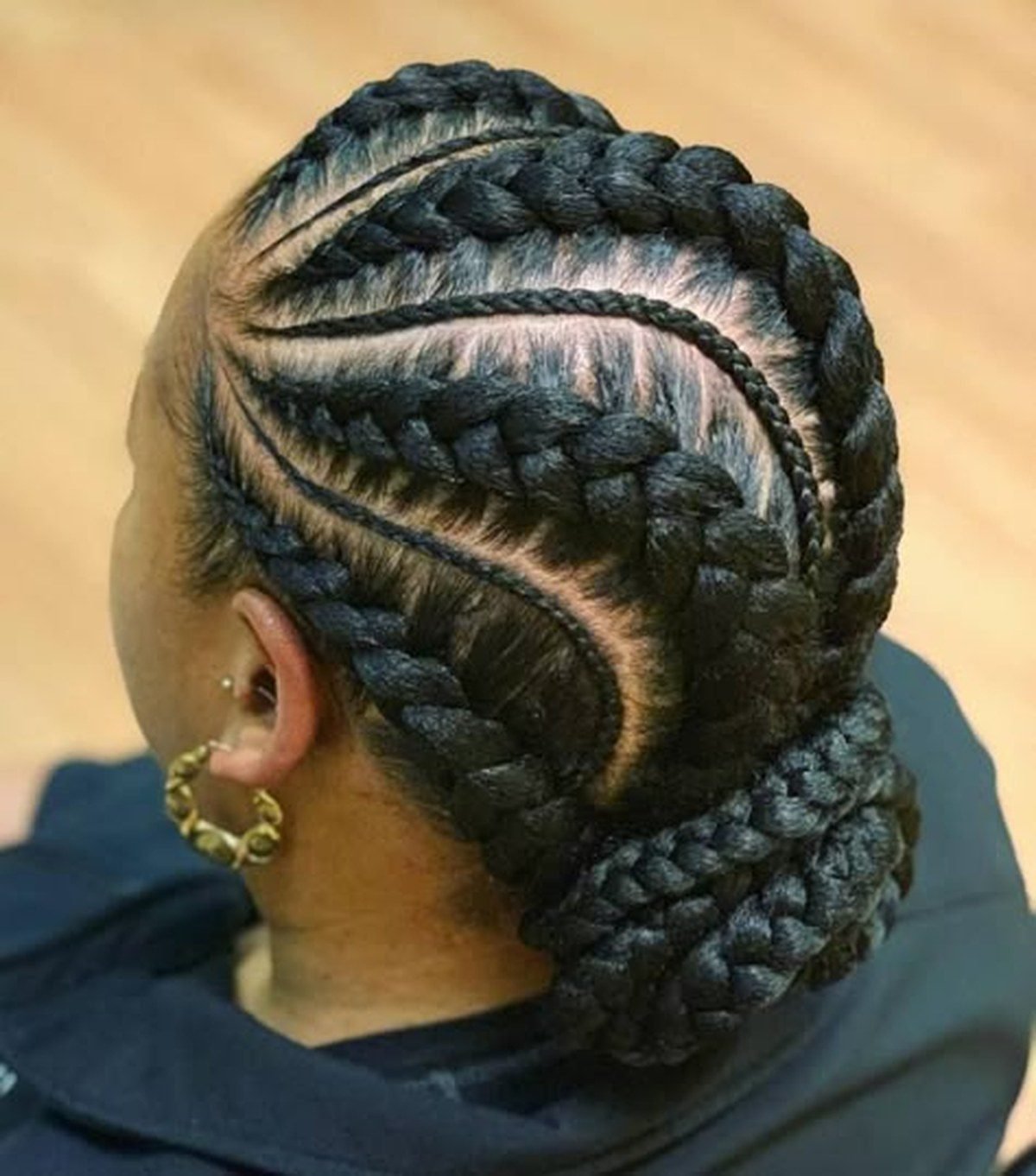 Feed-in cornrows gathered into a sleek low bun