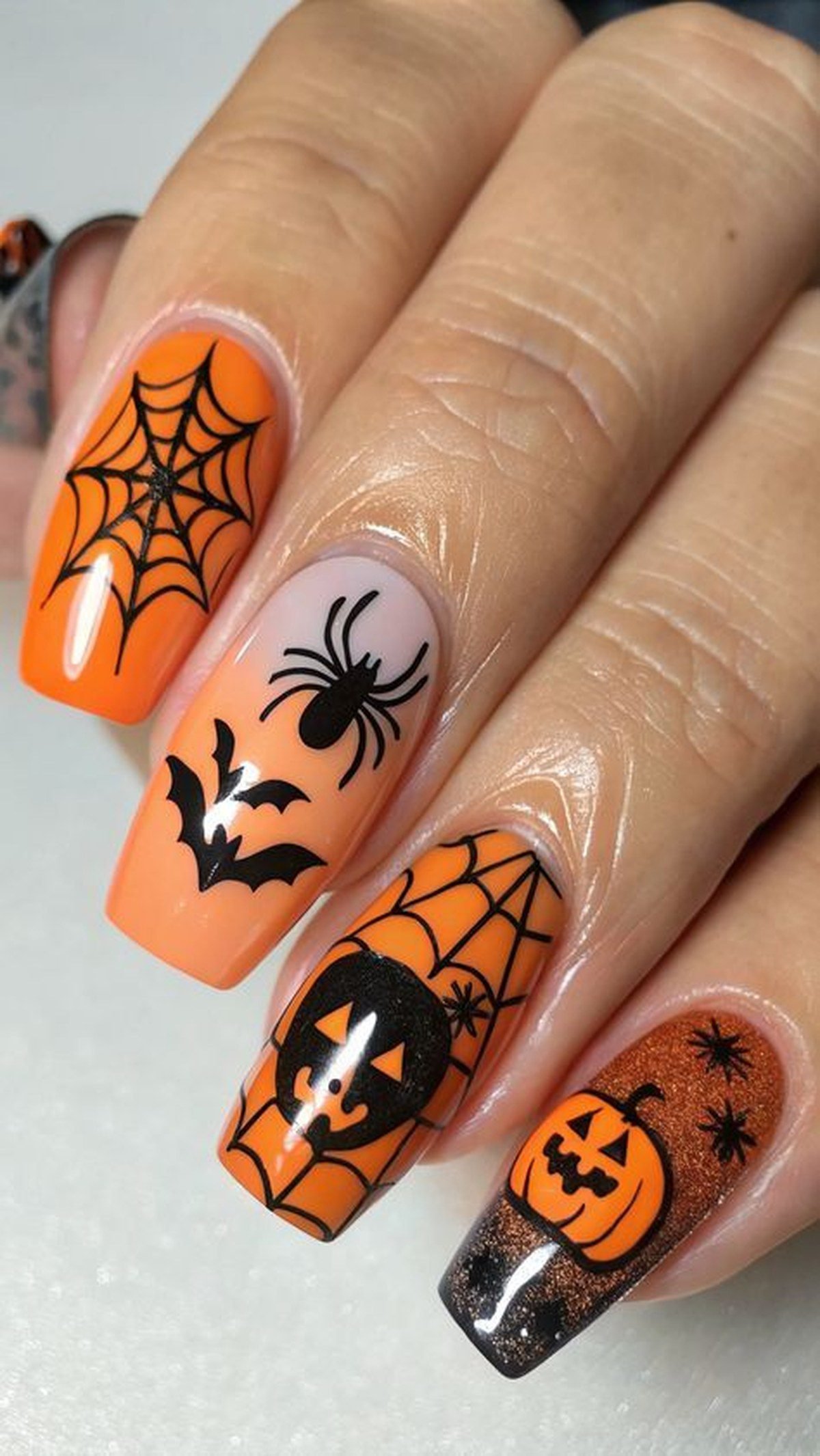 Spider accent nail art on long black nails