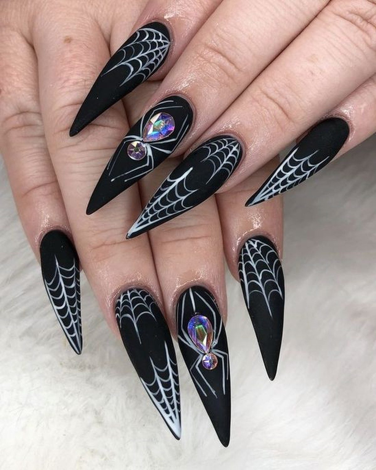 Spiderweb nail art on coffin shaped nails