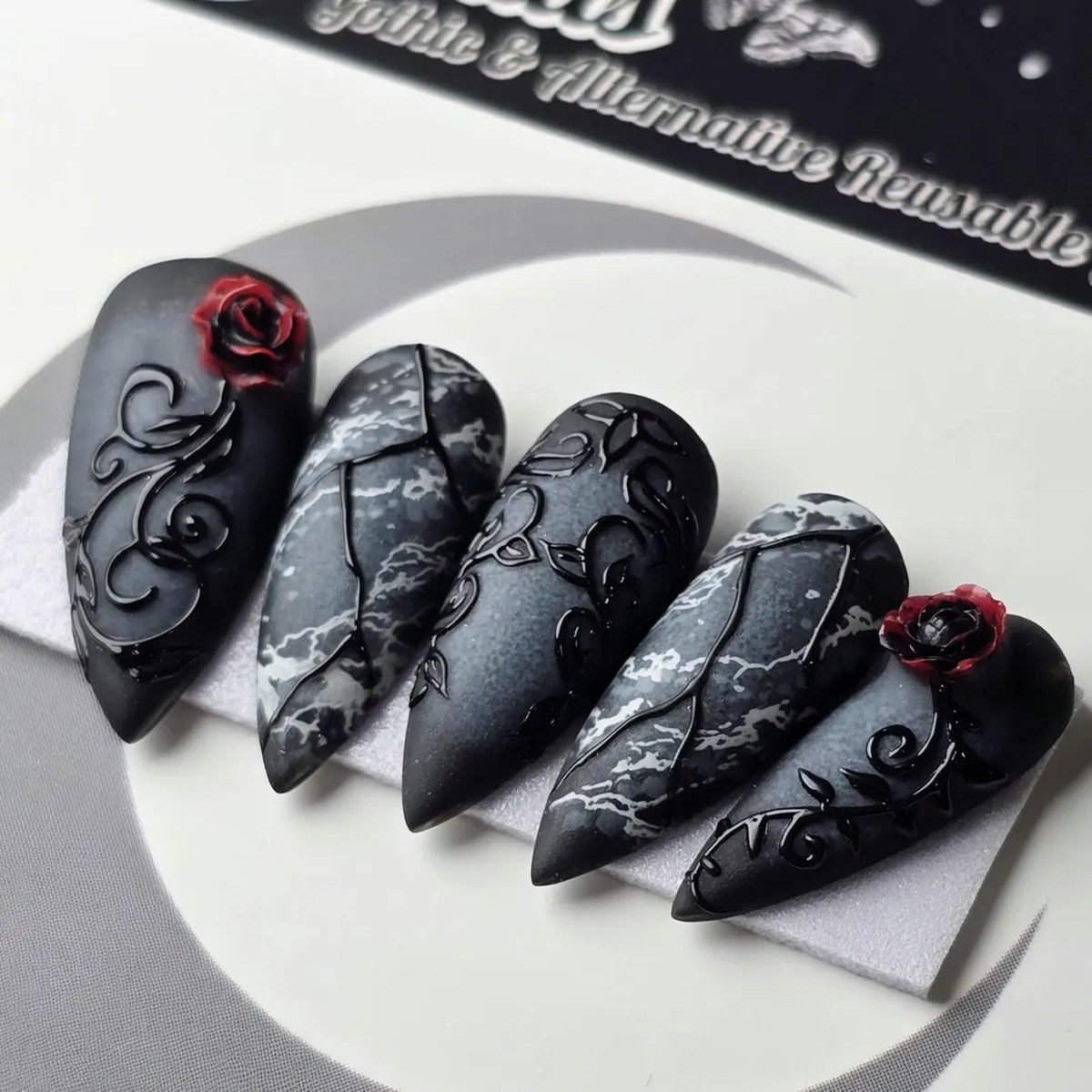Glossy black stiletto nails dramatic