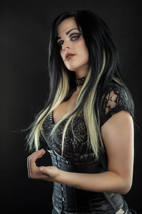 Sleek straight long black hair for a Morticia Addams costume