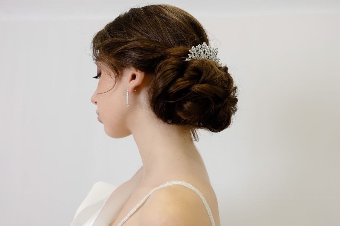 Woman with a sock bun updo hairstyle