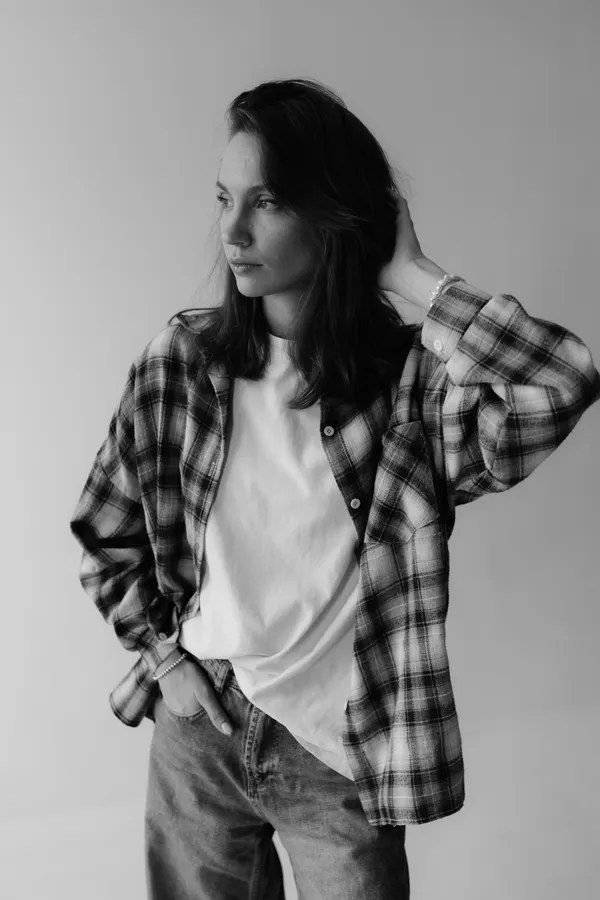 Woman in flannel shirt and jeans