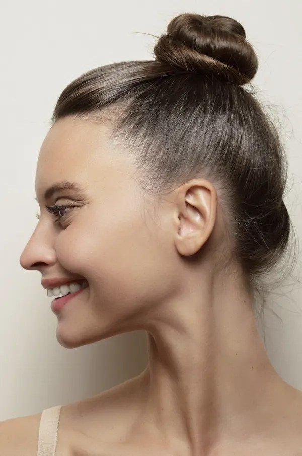Woman with slicked back hair gel style
