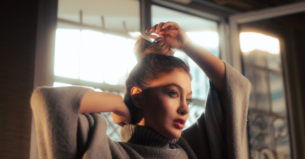 Woman with a top knot bun hairstyle