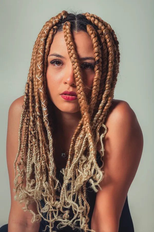 Intricate spiderweb-inspired braid on long hair