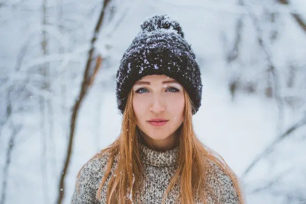 Woman wearing a beanie hat with hair