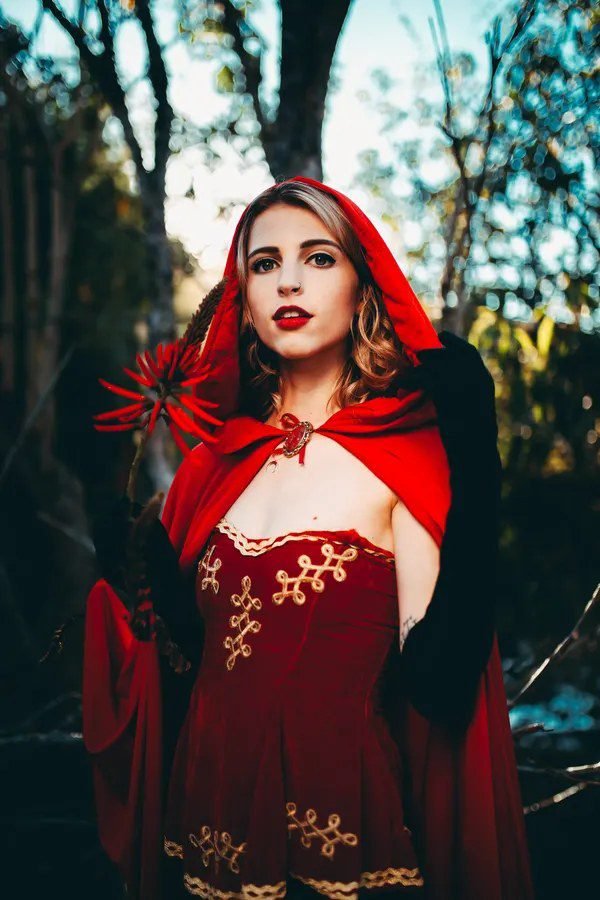 Woman in a red riding hood costume