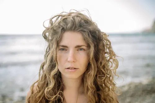 Woman with beach curls long hair