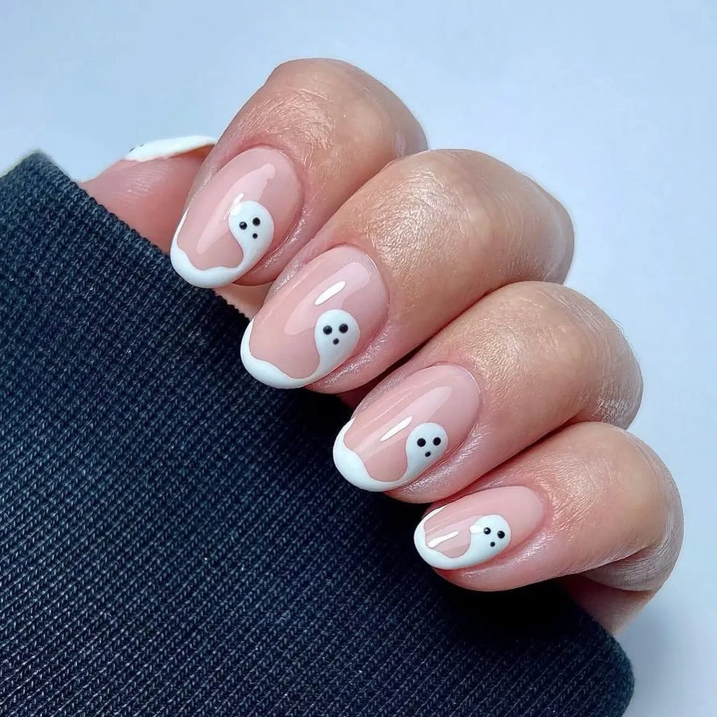 Milky white nails with single small ghost outline nail art