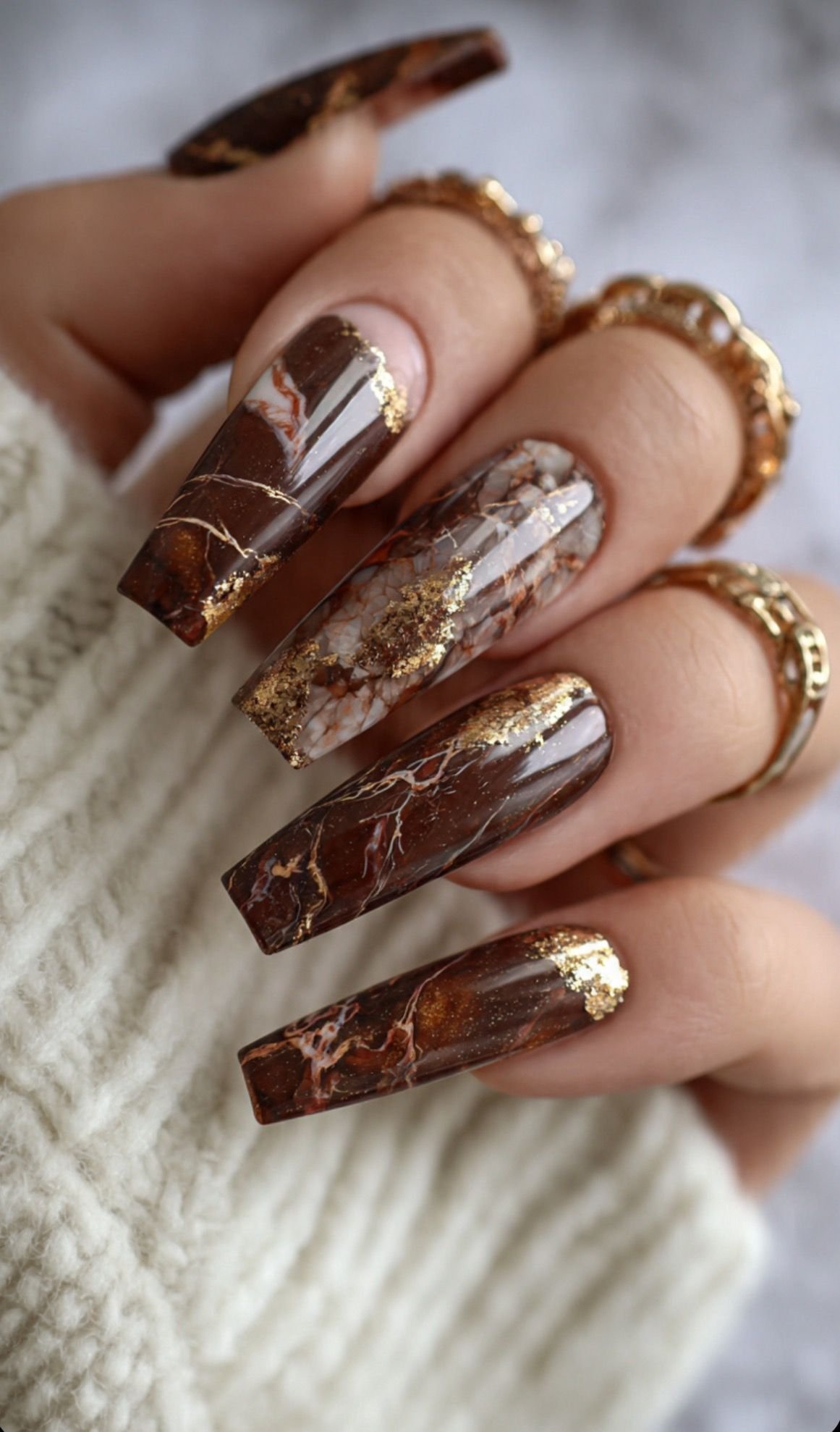 Brown and gold marble swirl nail art