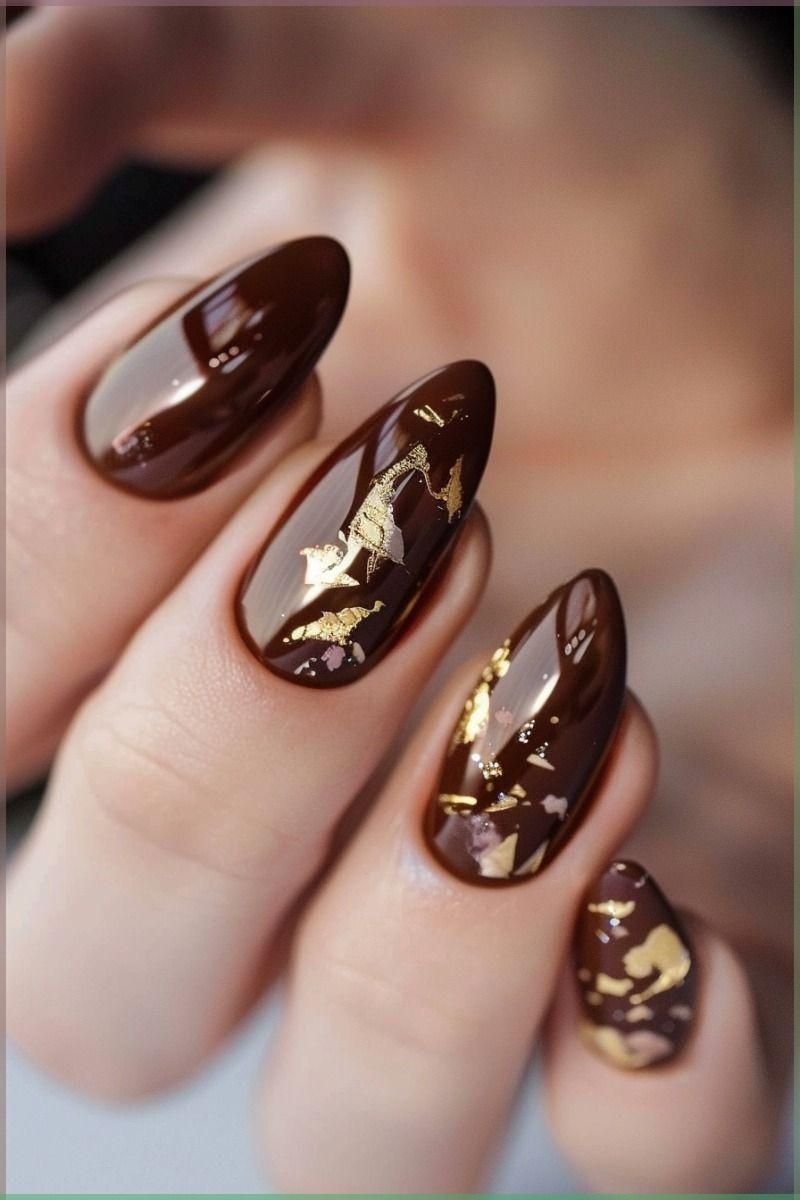 Dark brown almond nails with gold metallic cuticle cuff accents