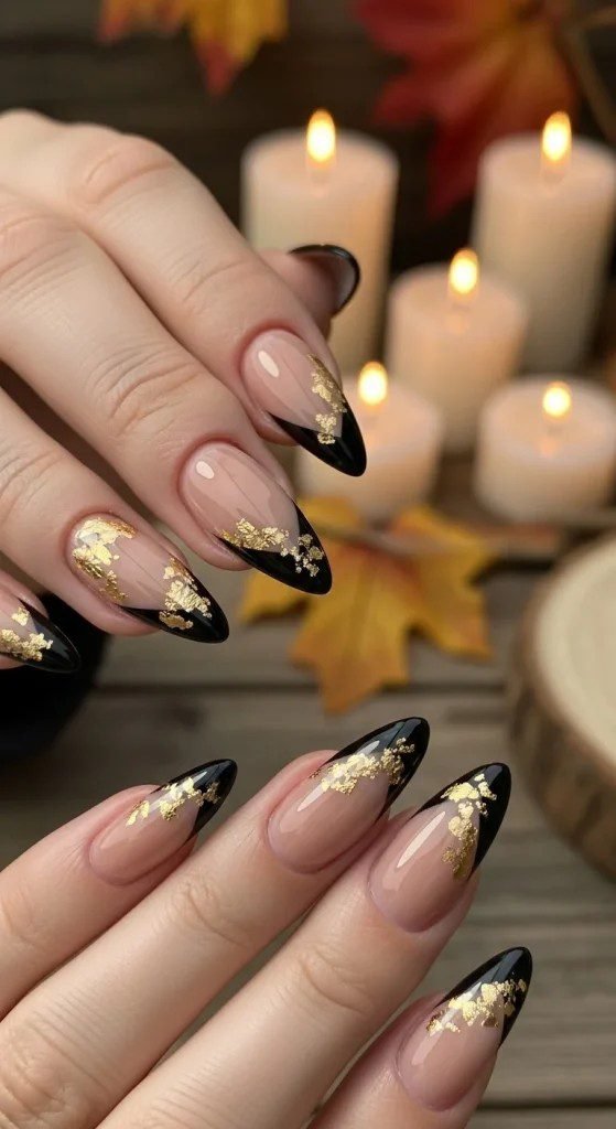 Matte black nails with gold foil accents