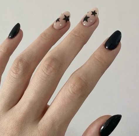 Bare natural nails with tiny black star nail art