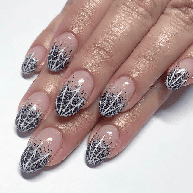 French manicure with delicate grey cobweb corner detail