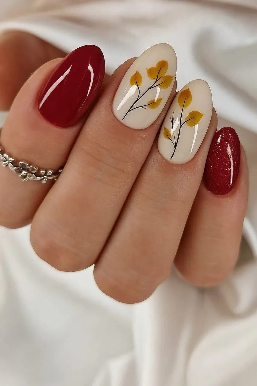 Almond nails with pumpkin spice swirls